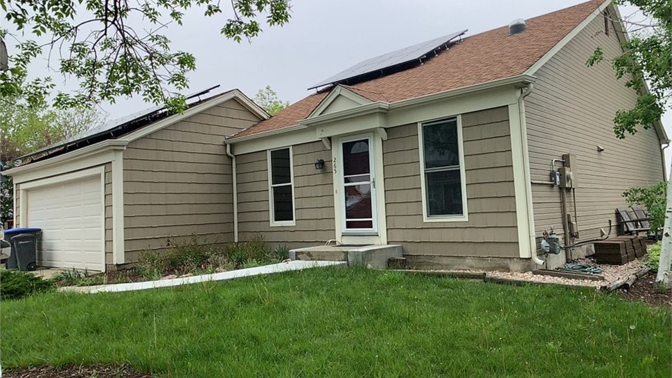 Full view of home before replacement on home before replacement with James Hardie and GAF roof on home in Lafayette Colorado