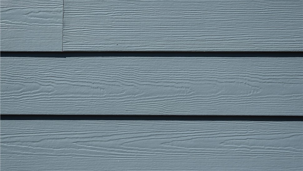 Close-up of new James Hardie lap siding in Evening Blue on a Boulder home