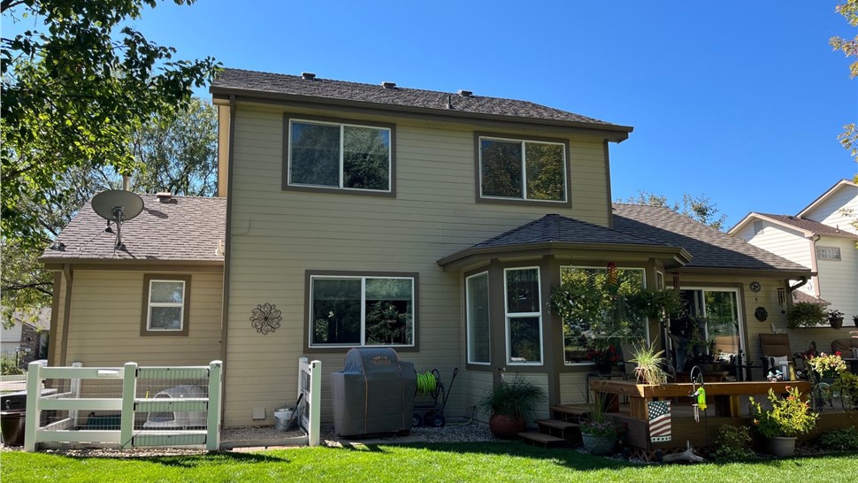 Water damaged siding and windows on home in Loveland Colorado before James Hardie and ProVia replacement