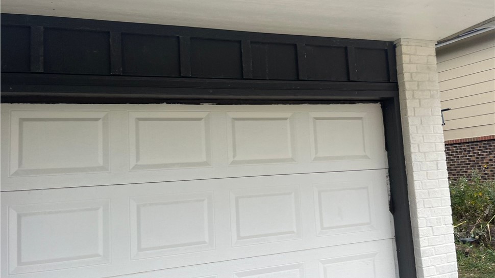 Dark Bronze trim coil wrapped garage door jamb on a Longmont home after replacement