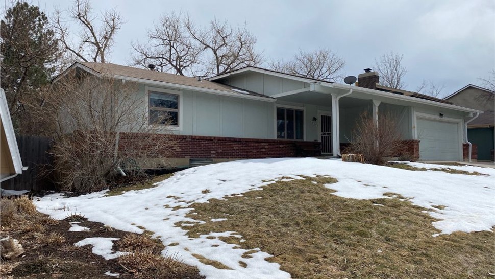 Complete exterior remodel before siding replacement and window replacement and roof replacement in Westminster Colorado