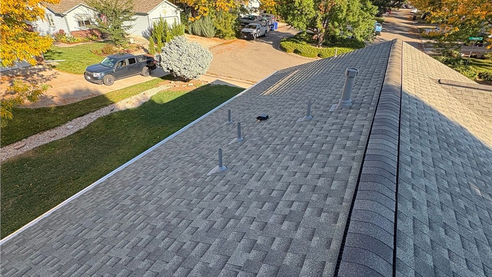 Completed GAF Timberline Armorshield II in Charcoal installation and new gutter system installation on home in Loveland Colorado