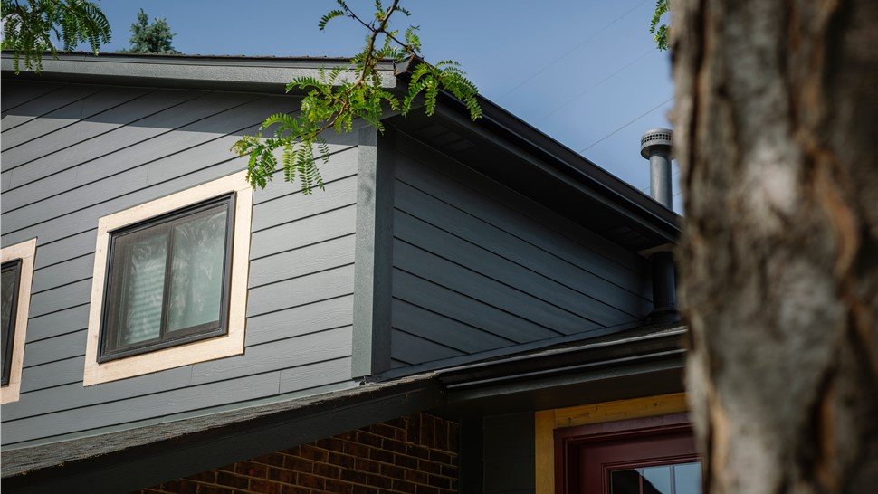Night Gray Hardie siding with Iron Gray trim on a home's gable end in Westminster, CO