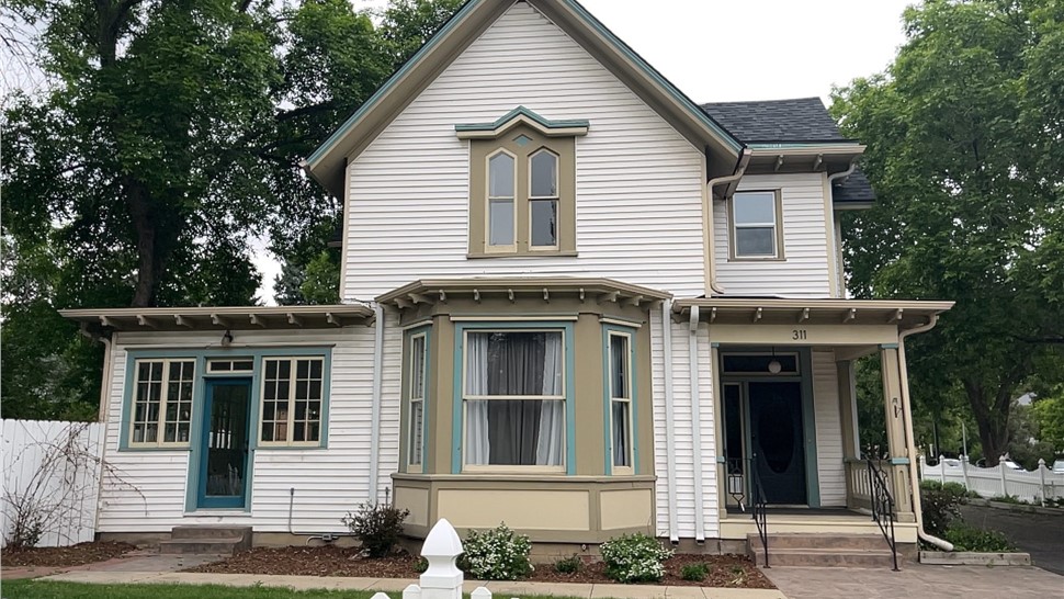 Home before James hardie primed siding installation in Old Town Longmont