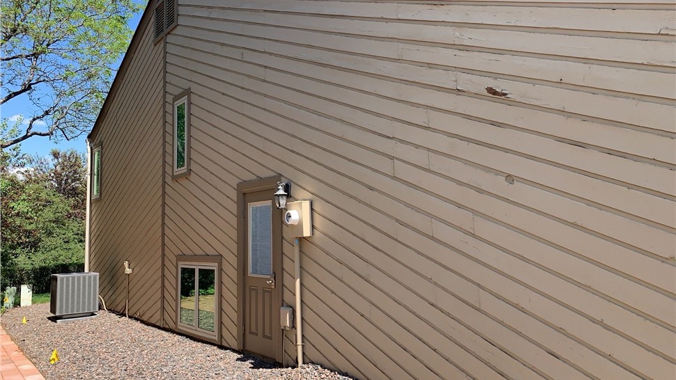 Cedar wood wall view of Louisville home in Colorado before James Hardie install