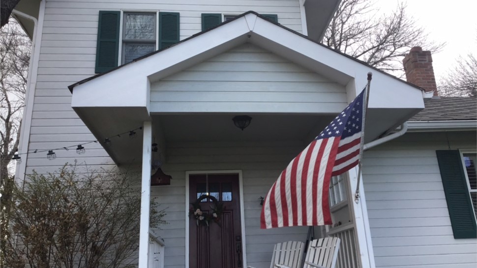 Original aging siding and roof on historic home in Fort Collins Colorado