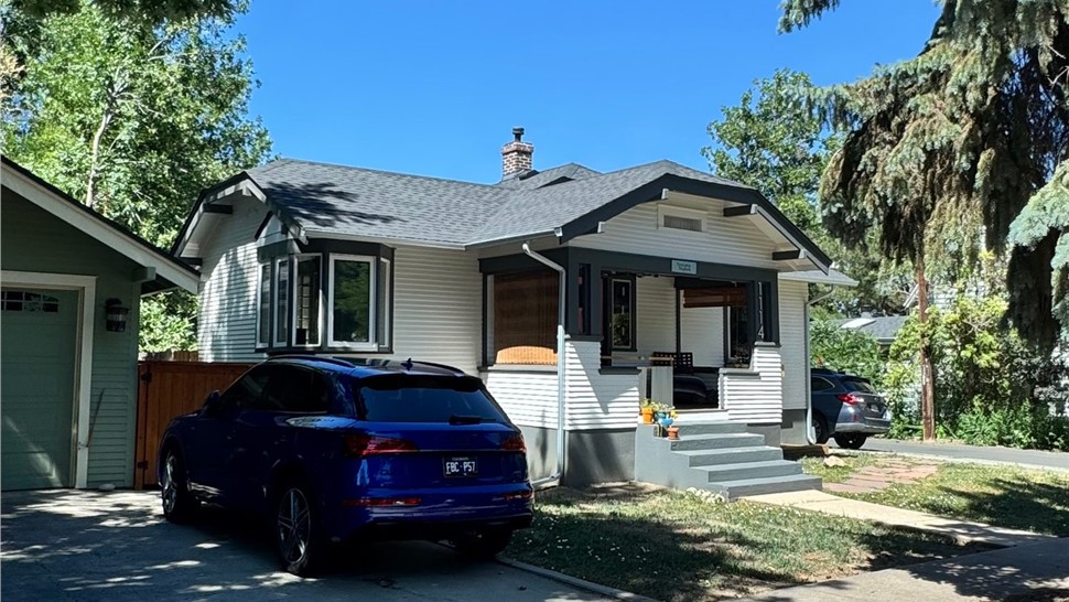 Front exterior of a Longmont home showing the new Endure vinyl windows and GAF ArmorShield II roof