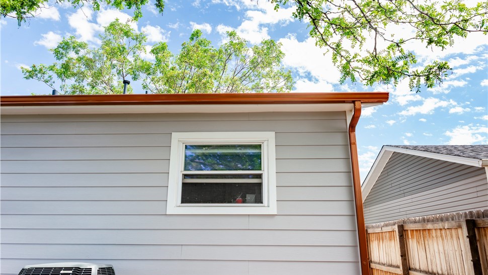 Siding and gutters on Thornton, Colorado homeafter full James Hardie Reside, GAF Armorshield II Installation and Gutter Replacement