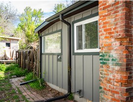 After image of completed James Hardie siding, roof & gutter replacement in Boulder Colorado featuring Aged Pewter ColorPlus siding with Iron Gray trim and GAF Armorshield roof in Charcoal Gray