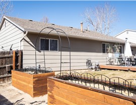 Entry before Longmont siding renovation with new entry door and windows