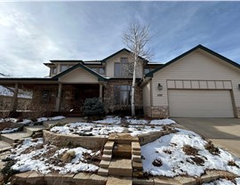 Home before siding, roofing and gutter install in Boulder, Colorado