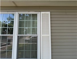 Siding, gutters and roofline before exterior remodel of Thornton home