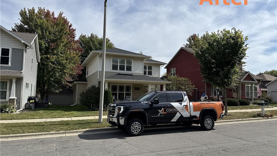 New Onyx Black Duration roof and seamless gutters on a home in Madison, WI.