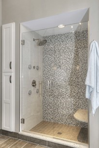 A shower with a glass doorAI-generated content may be incorrect.