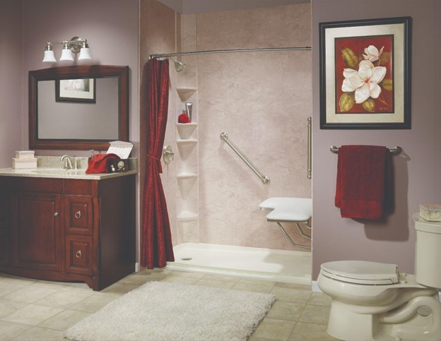 Photo of a ZINTEX remodel low barrier walk-in shower with acrylic walls